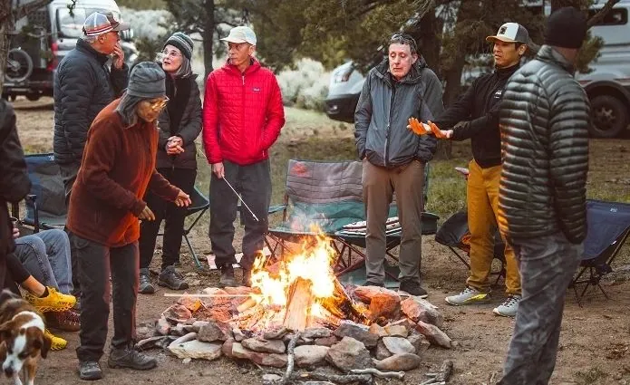 Guests gathered around a campfire